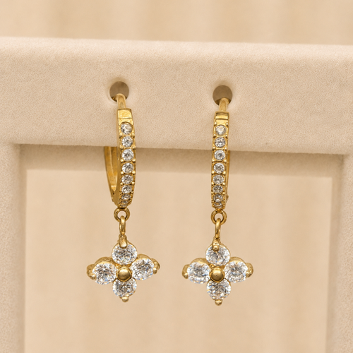 Chamak pavé huggie hoop earrings with a four-petal crystal flower drop, in gold