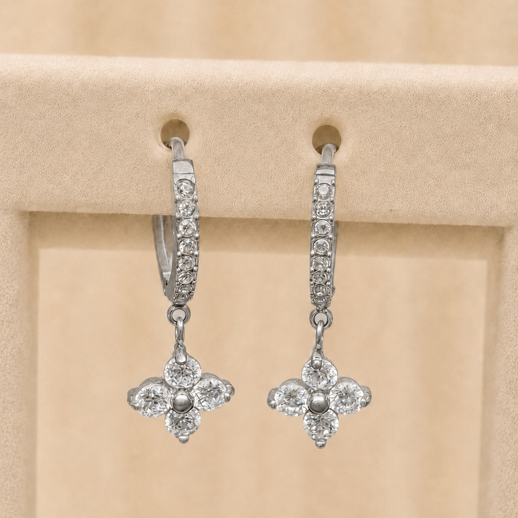 Chamak pavé huggie hoop earrings with a four-petal crystal flower drop, in silver