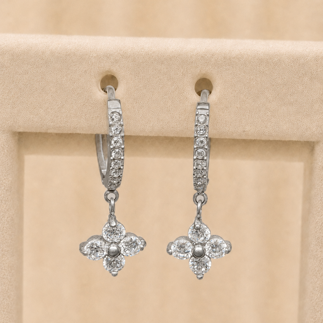 Chamak pavé huggie hoop earrings with a four-petal crystal flower drop, in silver