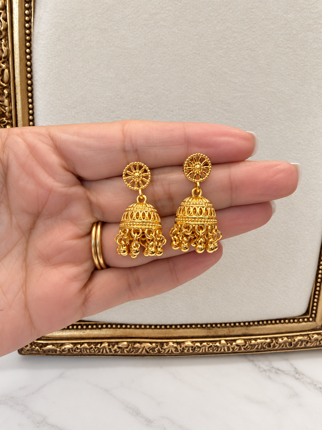Ghungroo temple jhumka earrings with a gold bead fringe, in gold